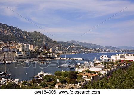 Boats docked at a harbor, Port of Fontvieille, Monte Carlo, Monaco View Large Photo Image Stock Photograph - Boats docked at a harbor, Port of Fontvieille, Monte Carlo, Monaco. Fotosearch