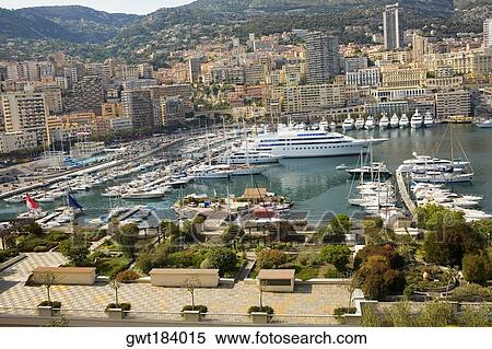 Boats docked at a harbor, Port of Fontvieille, Monte Carlo, Monaco View Large Photo Image Stock Photography - Boats docked at a harbor, Port of Fontvieille, Monte Carlo, Monaco. Fotosearch