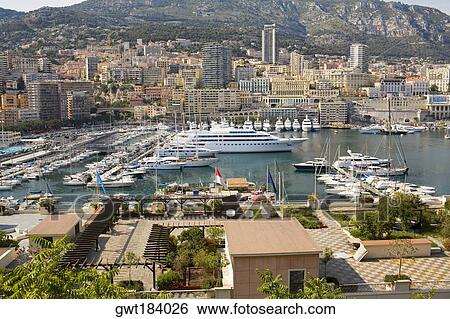 Ferries and boats docked at a harbor, Port of Fontvieille, Monte Carlo, Monaco View Large Photo Image Stock Photograph - Ferries and boats docked at a harbor, Port of Fontvieille, Monte Carlo, Monaco. Fotosearch