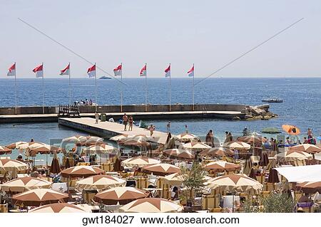 Tourists at a cafe on the beach, Monte Carlo, Monaco View Large Photo Image Stock Photo - Tourists at a cafe on the beach, Monte Carlo, Monaco. Fotosearch