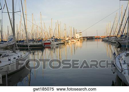 Boats moored at a port, Port Vell, Barcelona, Spain View Large Photo Image Stock Photography - Boats moored at a port, Port Vell, Barcelona, Spain. Fotosearch