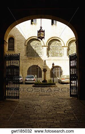 Stock Image - Cars parked in the courtyard of a building, Barcelona, Spain. Fotosearch