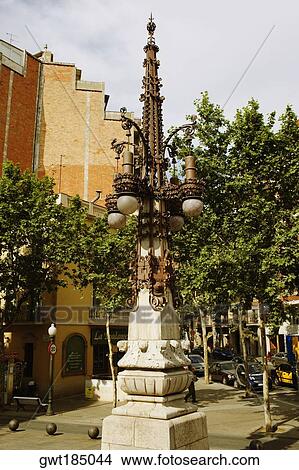 Lamppost in front of a building, Barcelona, Spain View Large Photo Image Picture - Lamppost in front of a building, Barcelona, Spain. Fotosearch