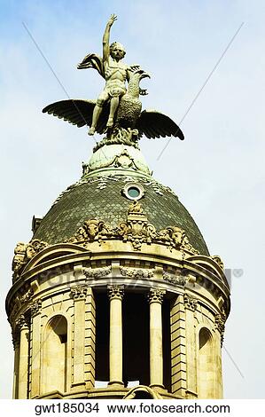 Low angle view of a statue on a dome, Barcelona, Spain View Large Photo Image Picture - Low angle view of a statue on a dome, Barcelona, Spain. Fotosearch