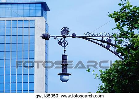 Low angle view of a street light in front of a building, Barcelona, Spain View Large Photo Image Stock Image - Low angle view of a street light in front of a building, Barcelona, Spain. Fotosearch
