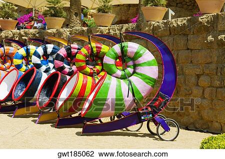 Multi-colored sculptures in a garden, Parc Guell, Barcelona, Spain View Large Photo Image Stock Image - Multi-colored sculptures in a garden, Parc Guell, Barcelona, Spain. Fotosearch