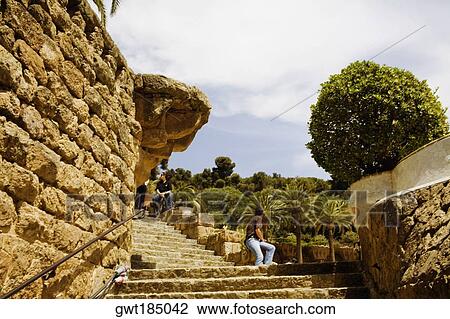 Stock Image - Staircases along a stone wall, Parc Guell, Barcelona, Spain. Fotosearch