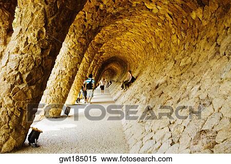 Tourists in the corridor of a building, Parc Guell, Barcelona, Spain View Large Photo Image Stock Photography - Tourists in the corridor of a building, Parc Guell, Barcelona, Spain. Fotosearch