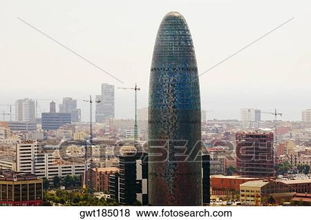 Tower in a city, Torre Agbar, Barcelona, Spain View Large Photo Image Stock Photo - Tower in a city, Torre Agbar, Barcelona, Spain. Fotosearch