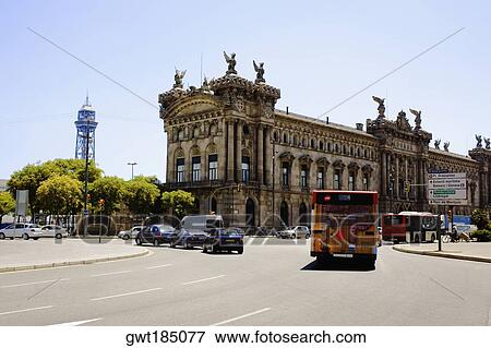 Stock Photo - Traffic on the road in front of a building, Barcelona, Spain. Fotosearch