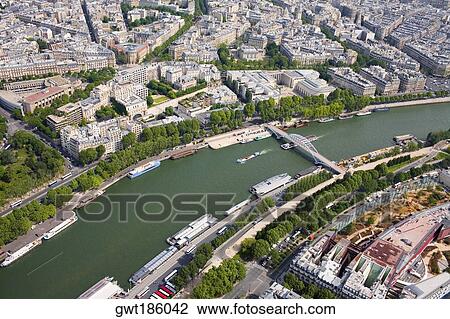 Aerial view of a river passing through a city, Passerelle Debilly, Seine River, Paris, France View Large Photo Image Stock Image - Aerial view of a river passing through a city, Passerelle Debilly, Seine River, Paris, France. Fotosearch