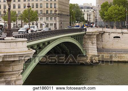 Arch bridge over a river, Paris, France View Large Photo Image Stock Image - Arch bridge over a river, Paris, France. Fotosearch