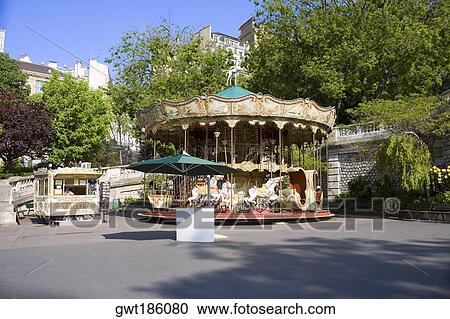 Carousel horse ride at a roadside, Paris, France View Large Photo Image Stock Image - Carousel horse ride at a roadside, Paris, France. Fotosearch