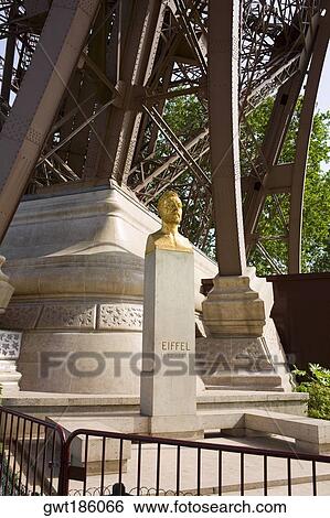 Golden statue near a tower, Eiffel Tower, Paris, France View Large Photo Image Stock Photograph - Golden statue near a tower, Eiffel Tower, Paris, France. Fotosearch