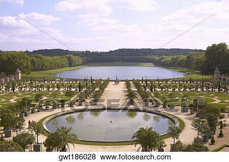 High angle view of a formal garden in front of a palace, Palace of Versailles, Versailles, France View Large Photo Image Stock Photo - High angle view of a formal garden in front of a palace, Palace of Versailles, Versailles, France. Fotosearch