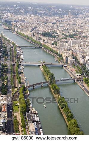 Stock Image - High angle view of a river passing through a city, Seine River, Paris, France. Fotosearch