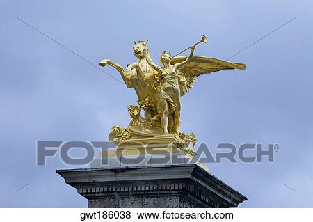 Low angle view of a gilded statue, La Renommee Au Combat, Pont Alexandre III, Paris, France View Large Photo Image Stock Photo - Low angle view of a gilded statue, La Renommee Au Combat, Pont Alexandre III, Paris, France. Fotosearch