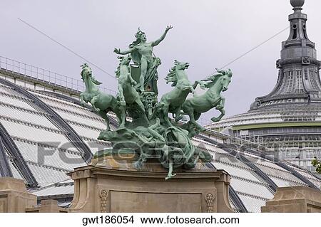 Picture - Low angle view of a statue on a building, Galeries Nationales du Grand Palais, Paris, France. Fotosearch