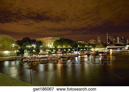 Tourboats docked at a port, Seine River, Paris, France View Large Photo Image Stock Photo - Tourboats docked at a port, Seine River, Paris, France. Fotosearch