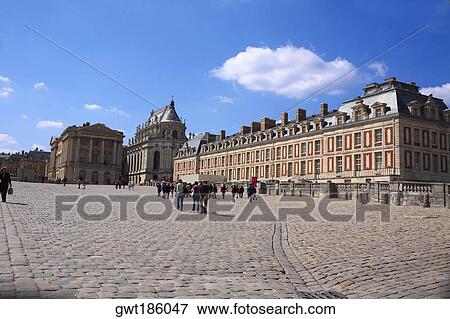 Stock Photo - Tourists in front of a palace, Palace of Versailles, Versailles, France. Fotosearch