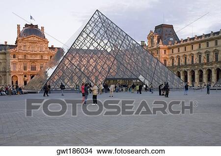 Picture - Tourists in front of an art museum, Louvre Pyramid, Musee Du Louvre, Paris, France. Fotosearch