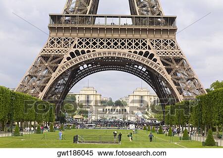 Tourists near a tower, Eiffel Tower, Paris, France View Large Photo Image Stock Photography - Tourists near a tower, Eiffel Tower, Paris, France. Fotosearch