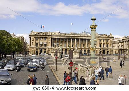 Picture - Traffic on a road in front of a hotel, Hotel Crillon, Paris, France. Fotosearch