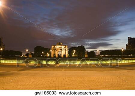 Triumphal arch lit up at dusk, Paris, France View Large Photo Image Stock Image - Triumphal arch lit up at dusk, Paris, France. Fotosearch