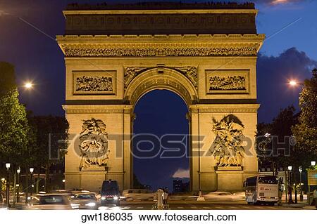 Stock Photography - Triumphal arch lit up at night, Arc De Triomphe, Paris, France. Fotosearch