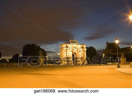 Triumphal arch lit up at night, Jardin De Tuileries, Paris, France View Large Photo Image Stock Photo - Triumphal arch lit up at night, Jardin De Tuileries, Paris, France. Fotosearch