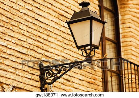 Stock Image - Close-up of a lantern mounted on a wall, Toledo, Spain. Fotosearch