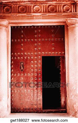 Stock Photo - Red door of a house, Toledo, Spain. Fotosearch