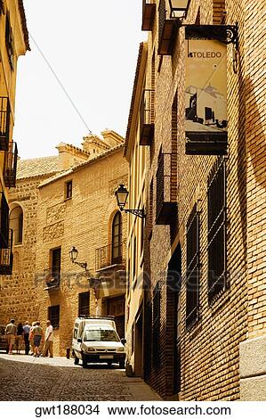 Tourists walking on the street, Toledo, Spain View Large Photo Image Picture - Tourists walking on the street, Toledo, Spain. Fotosearch