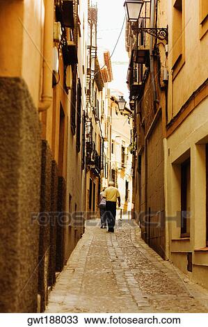 Tourists walking on the street, Toledo, Spain View Large Photo Image Stock Image - Tourists walking on the street, Toledo, Spain. Fotosearch
