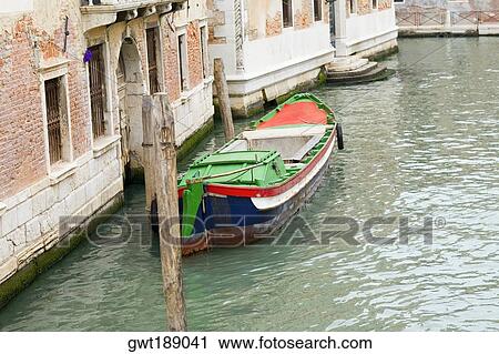 Boat docked in a canal, Grand Canal, Venice, Italy View Large Photo Image Stock Image - Boat docked in a canal, Grand Canal, Venice, Italy. Fotosearch
