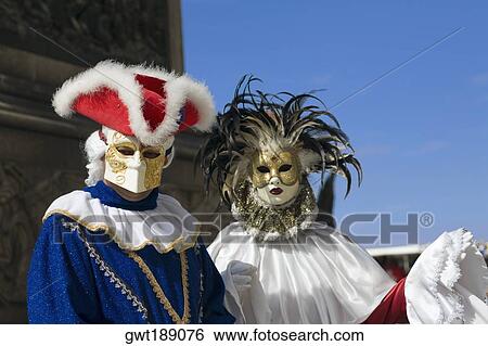 Close-up of two people wearing masquerade masks, Venice, Italy View Large Photo Image Stock Photograph - Close-up of two people wearing masquerade masks, Venice, Italy. Fotosearch