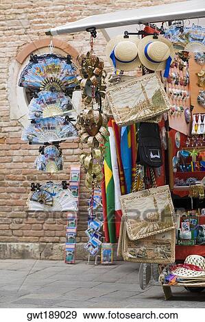 Craft products hanging in a market stall, Venice, Italy View Large Photo Image Stock Photo - Craft products hanging in a market stall, Venice, Italy. Fotosearch