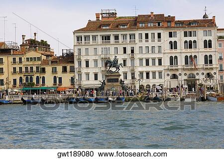 Gondolas docked in front of a statue, Vittorio Emanuele II Statue, Riva Degli Schiavoni, Venice, Italy View Large Photo Image Stock Image - Gondolas docked in front of a statue, Vittorio Emanuele II Statue, Riva Degli Schiavoni, Venice, Italy. Fotosearch