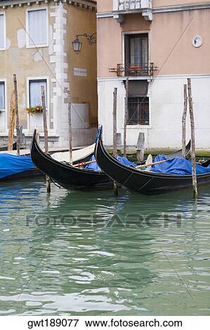 Gondolas docked in front of buildings, Venice, Italy View Large Photo Image Stock Photo - Gondolas docked in front of buildings, Venice, Italy. Fotosearch