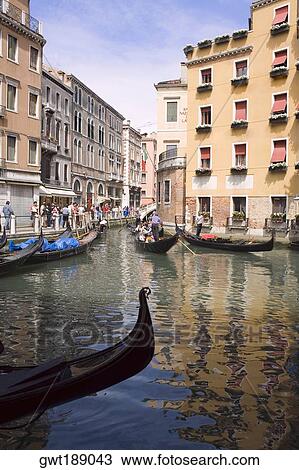 Stock Image - Gondolas in a canal, Venice, Italy. Fotosearch