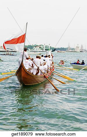 Group of people standing in a gondola on a canal, Regatta Storica, Venice, Italy View Large Photo Image Stock Photo - Group of people standing in a gondola on a canal, Regatta Storica, Venice, Italy. Fotosearch