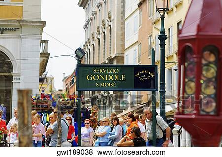 Group of people standing near a signboard, Venice, Italy View Large Photo Image Stock Photo - Group of people standing near a signboard, Venice, Italy. Fotosearch
