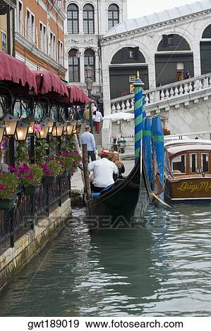 Stock Photo - Restaurant at the waterfront, Grand Canal, Venice, Italy. Fotosearch