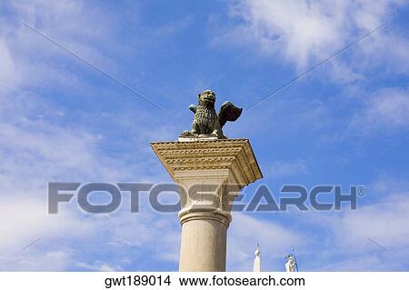 Statue of winged lion on a column, St. Mark's Square, Venice, Italy View Large Photo Image Picture - Statue of winged lion on a column, St. Mark's Square, Venice, Italy. Fotosearch