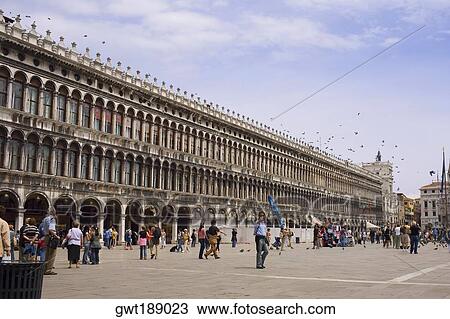 Tourists in front of a building, St. Mark's Square, Venice, Italy View Large Photo Image Stock Image - Tourists in front of a building, St. Mark's Square, Venice, Italy. Fotosearch
