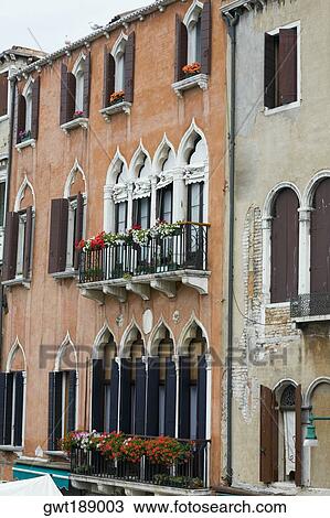 Window boxes hanging on the railings of windows, Venice, Italy View Large Photo Image Stock Image - Window boxes hanging on the railings of windows, Venice, Italy. Fotosearch