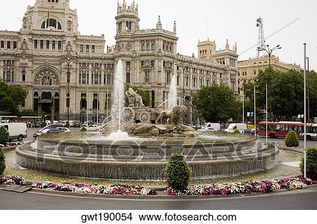 Fountain in front of a government building, Cibeles Fountain, Palacio De Comunicaciones, Plaza de Cibeles, Madrid, Spain View Large Photo Image Picture - Fountain in front of a government building, Cibeles Fountain, Palacio De Comunicaciones, Plaza de Cibeles, Madrid, Spain. Fotosearch