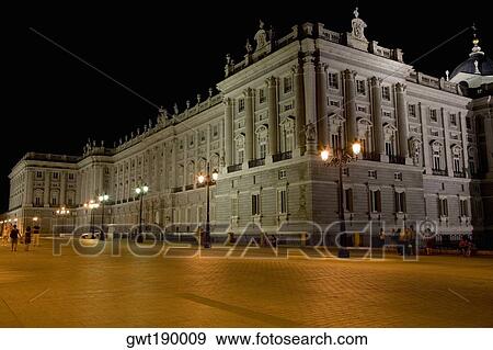 Lampposts lit up in front of a palace lit up at night, Madrid Royal Palace, Madrid, Spain View Large Photo Image Stock Photo - Lampposts lit up in front of a palace lit up at night, Madrid Royal Palace, Madrid, Spain. Fotosearch