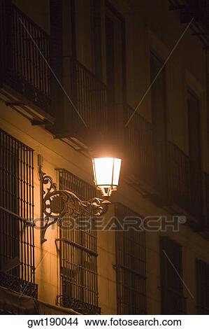 Lantern on a building lit up at night, Madrid, Spain View Large Photo Image Picture - Lantern on a building lit up at night, Madrid, Spain. Fotosearch