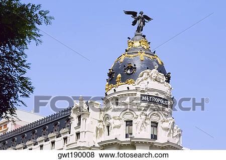 Low angle view of a building, Metropolis Building, Madrid, Spain View Large Photo Image Stock Photo - Low angle view of a building, Metropolis Building, Madrid, Spain. Fotosearch